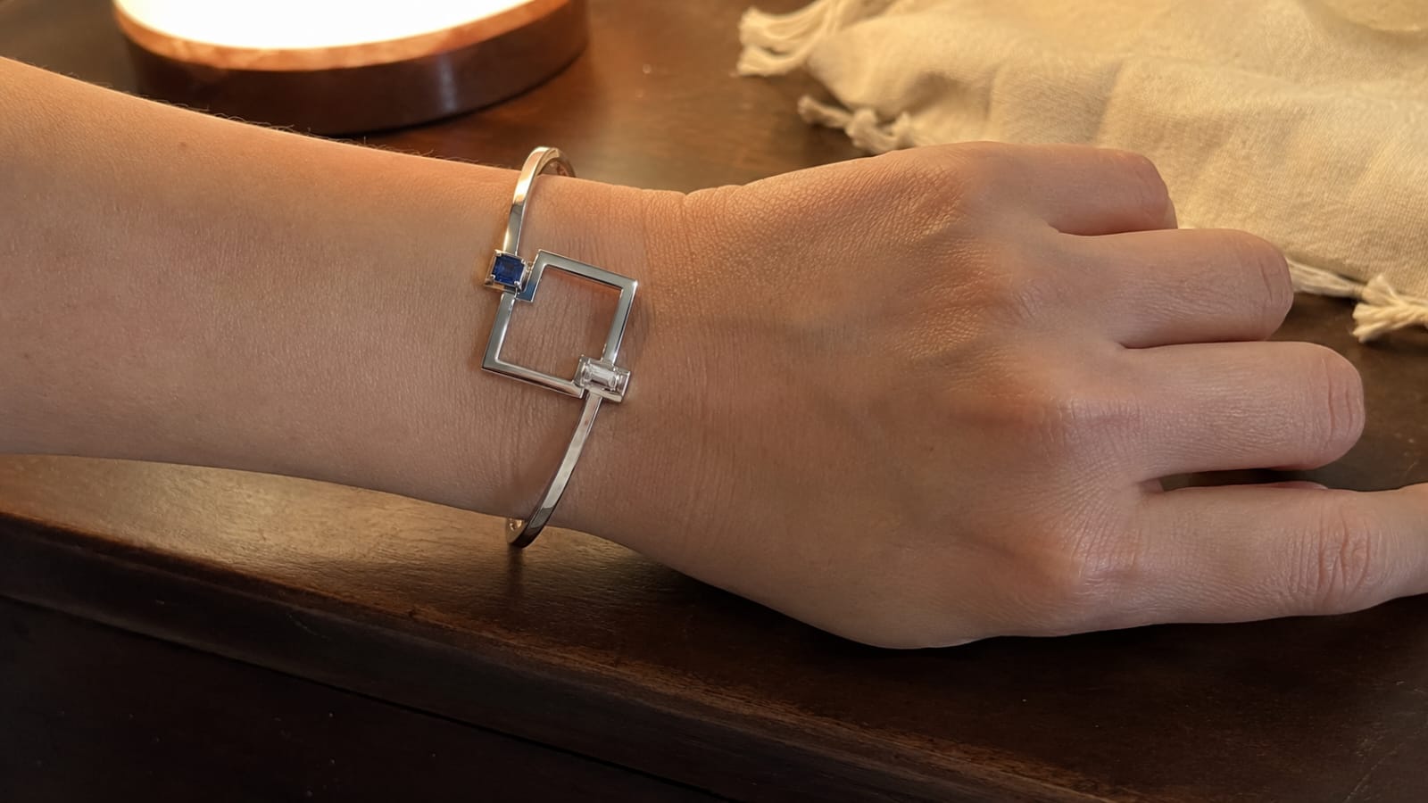 Frame Language collection — geometric 18K gold jewelry with diamonds, emeralds, and sapphires